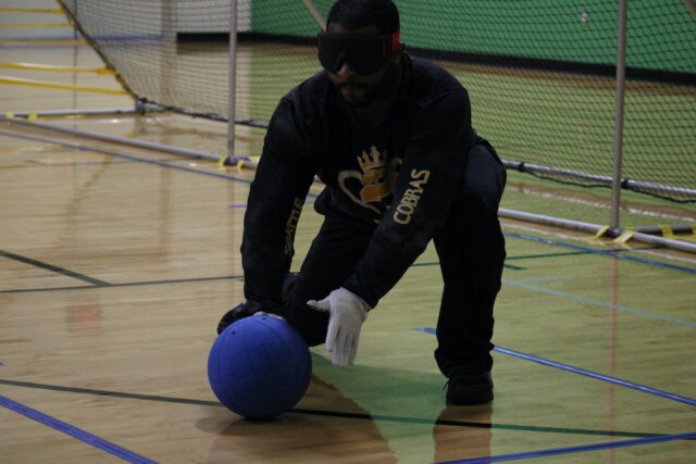 Athlete blocking the goal during a game of goalball.