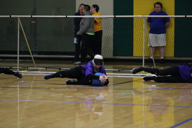 Athlete blocking the goal during a game of goalball.