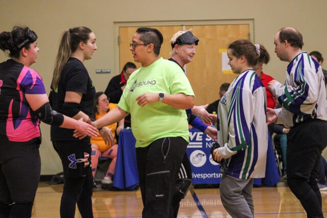 People shaking hands at an ASNW event.