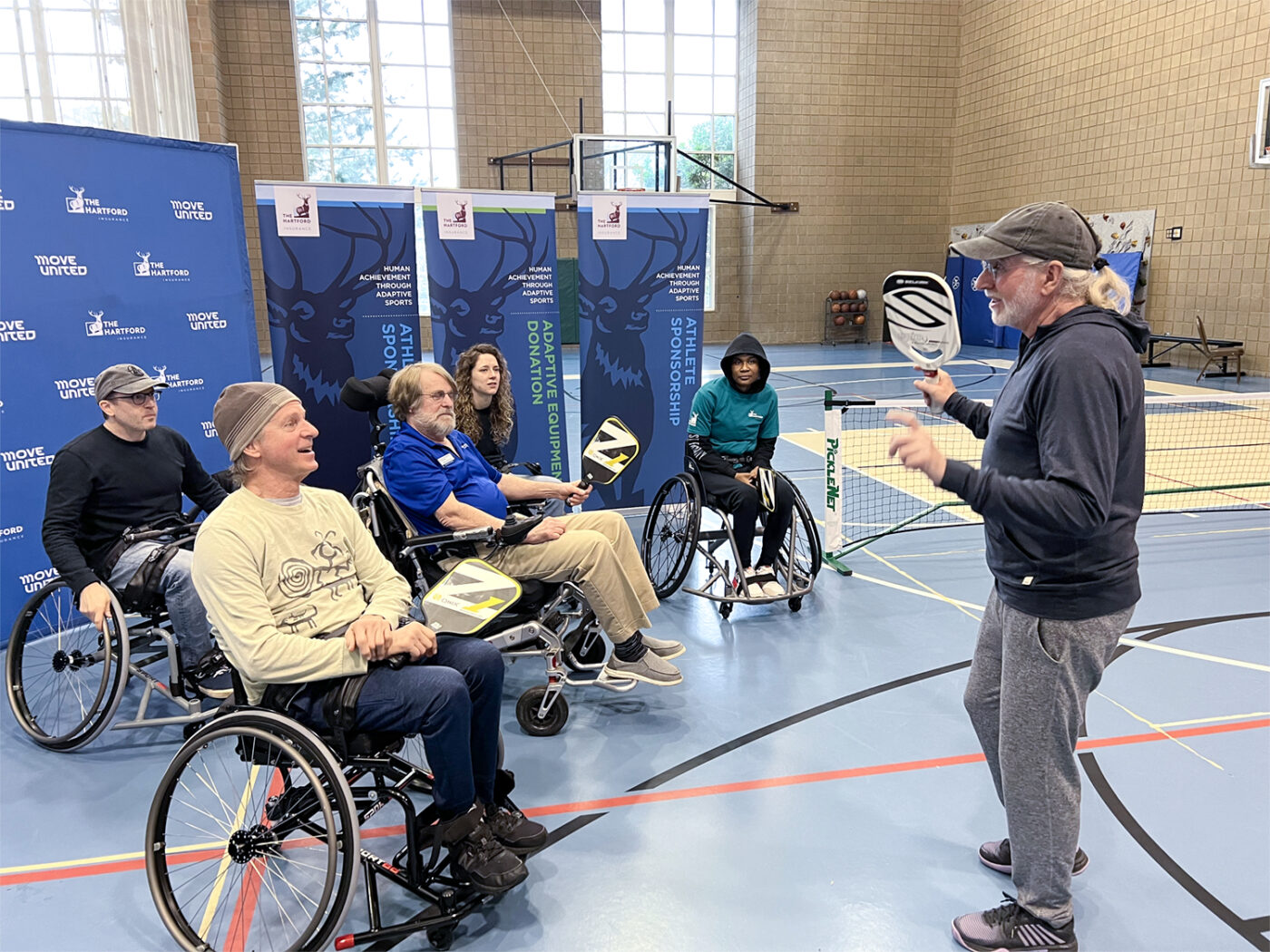 Pickleball gallery - Activation event, instructor and group.