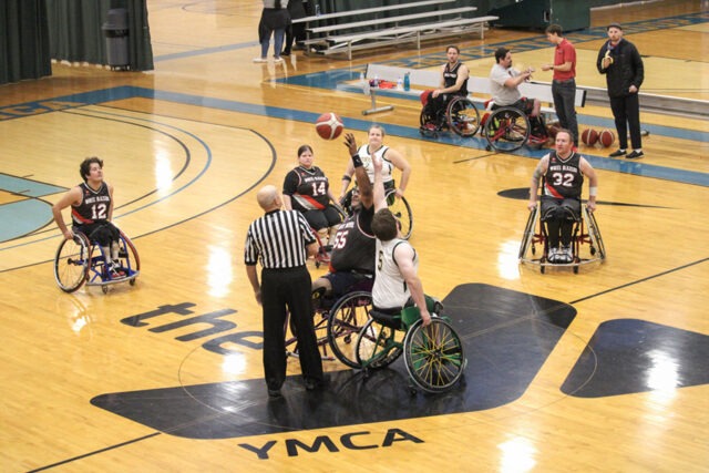 Wheelchair basketball players tip-off.