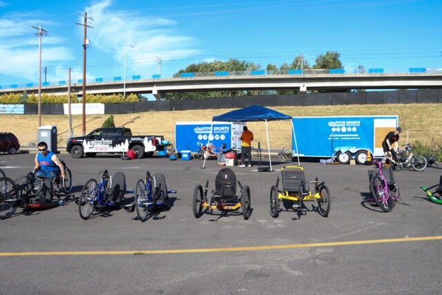 Row of adaptive cycles at an outdoor ASNW event.