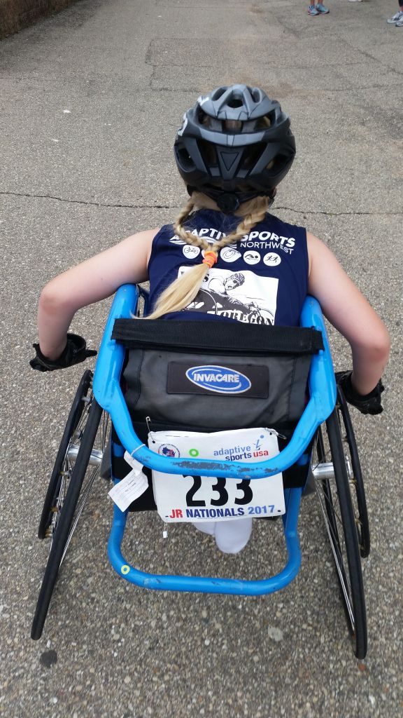 Young track and field athlete in a wheelchair.